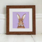 Bunny illustration on a purple background in light wood frame