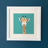 Giraffe illustration on teal background, in a white frame and wall mounted