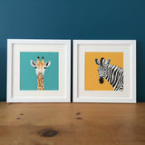 Giraffe and Zebra prints framed, side by side