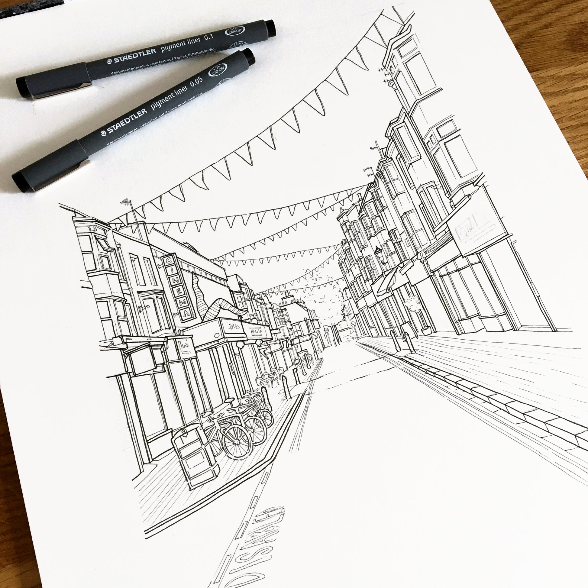 Progress image of a Brighton street scene sketch in black fine liner pen.